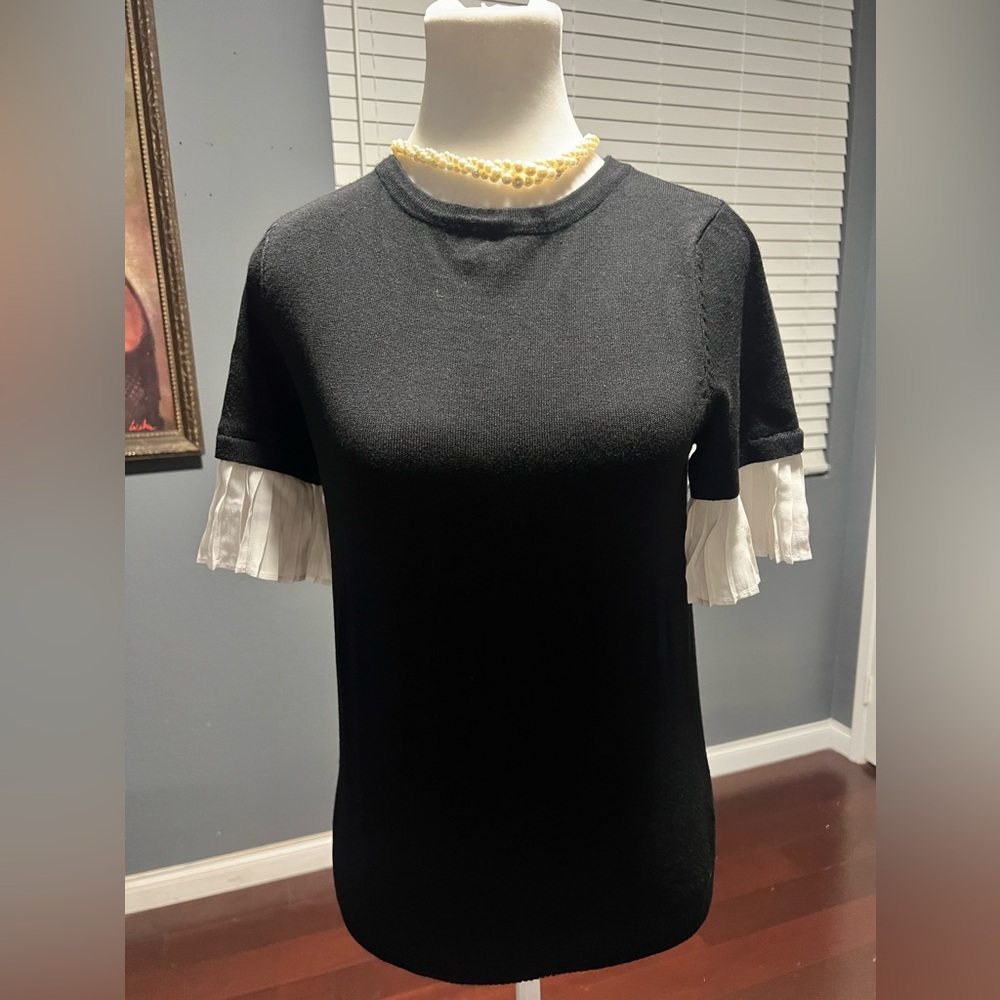 Black Soft Knit Cardigan with White Pleated Sleeves.